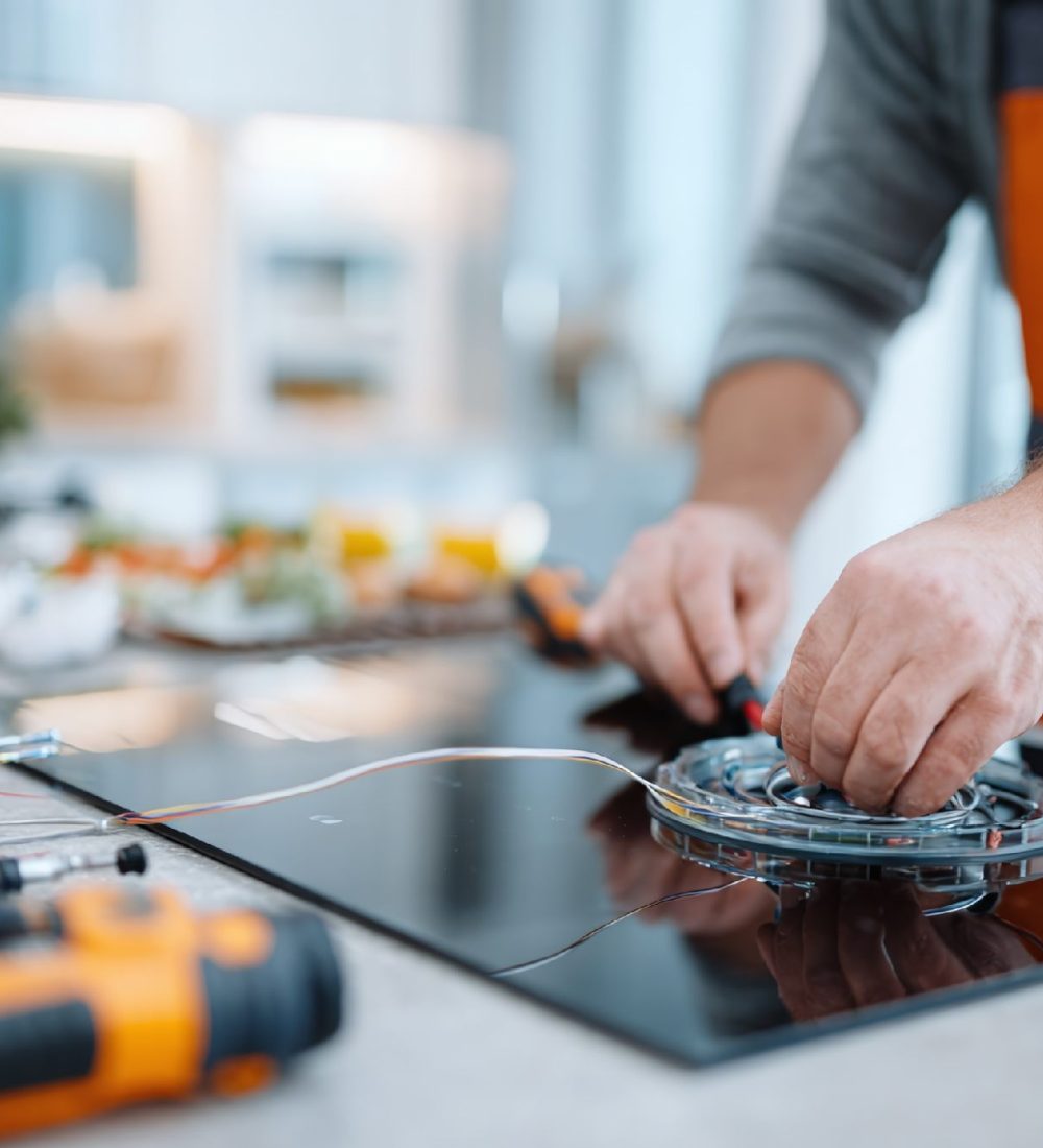 qwwrty5251_Electrician_connecting_an_induction_cooktop_in_a_m_5fa1b242-020f-4daf-82c3-80410587bca8_2 qwwrty5251_Electrician_connecting_an_induction_cooktop_in_a_m_5fa1b242-020f-4daf-82c3-80410587bca8_2